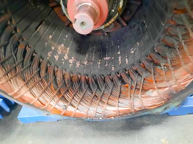 The stator winding from the rotor scraping during testing as the rotor fell from the ODE bearing damage.