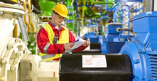 Process operator inspecting a centrifugal pump in the field.
