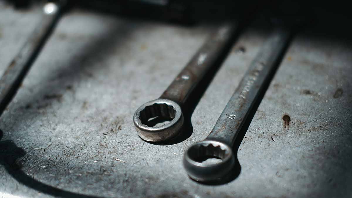 Two wrenches in dark area