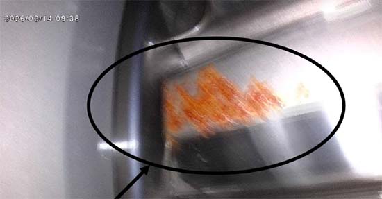 Figure 2.  A large oxidation mark spread across the contact face of a gear tooth.